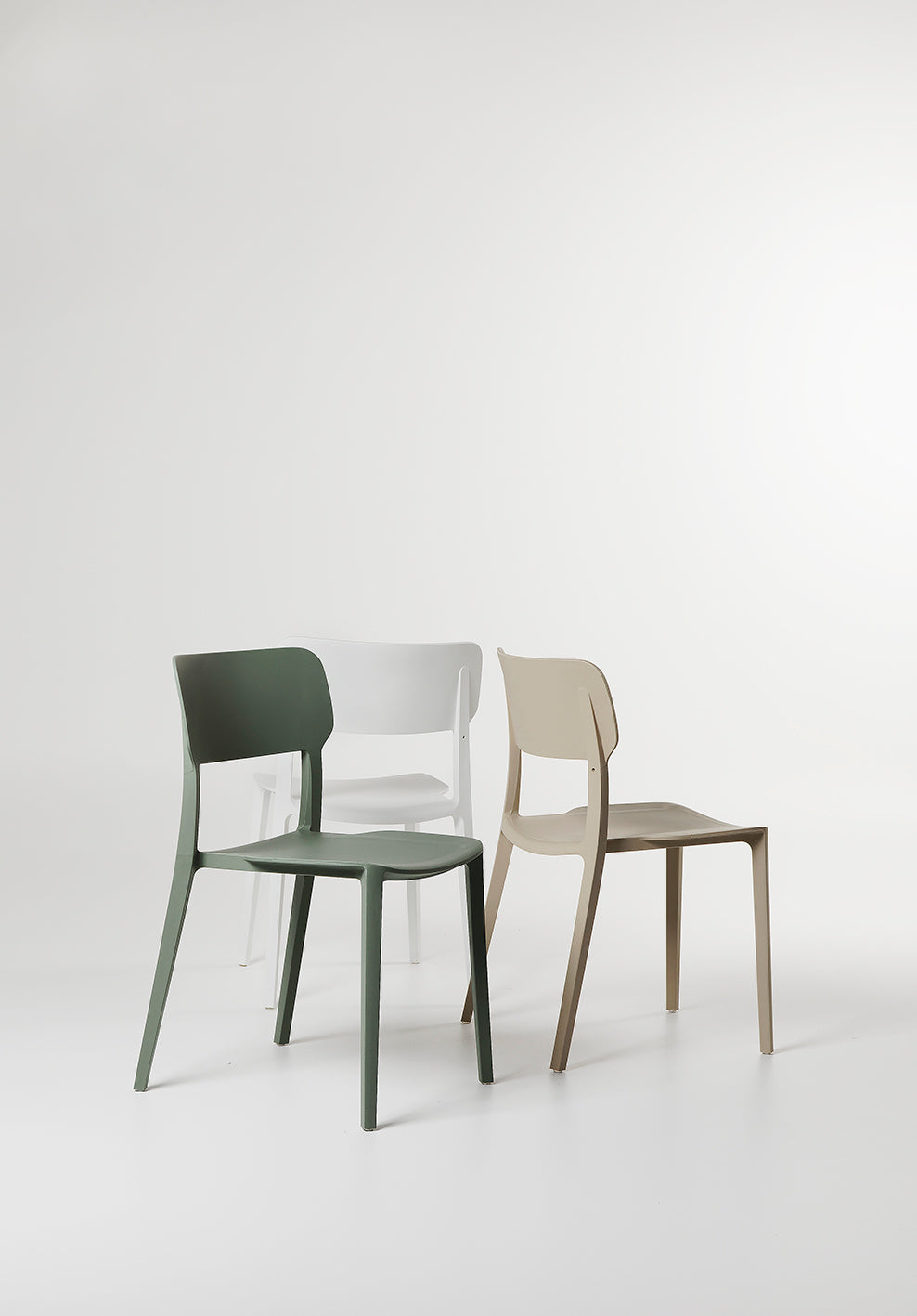 Back view of the Beige Alex Chair highlighting its modern cut-out backrest and minimalist shape.