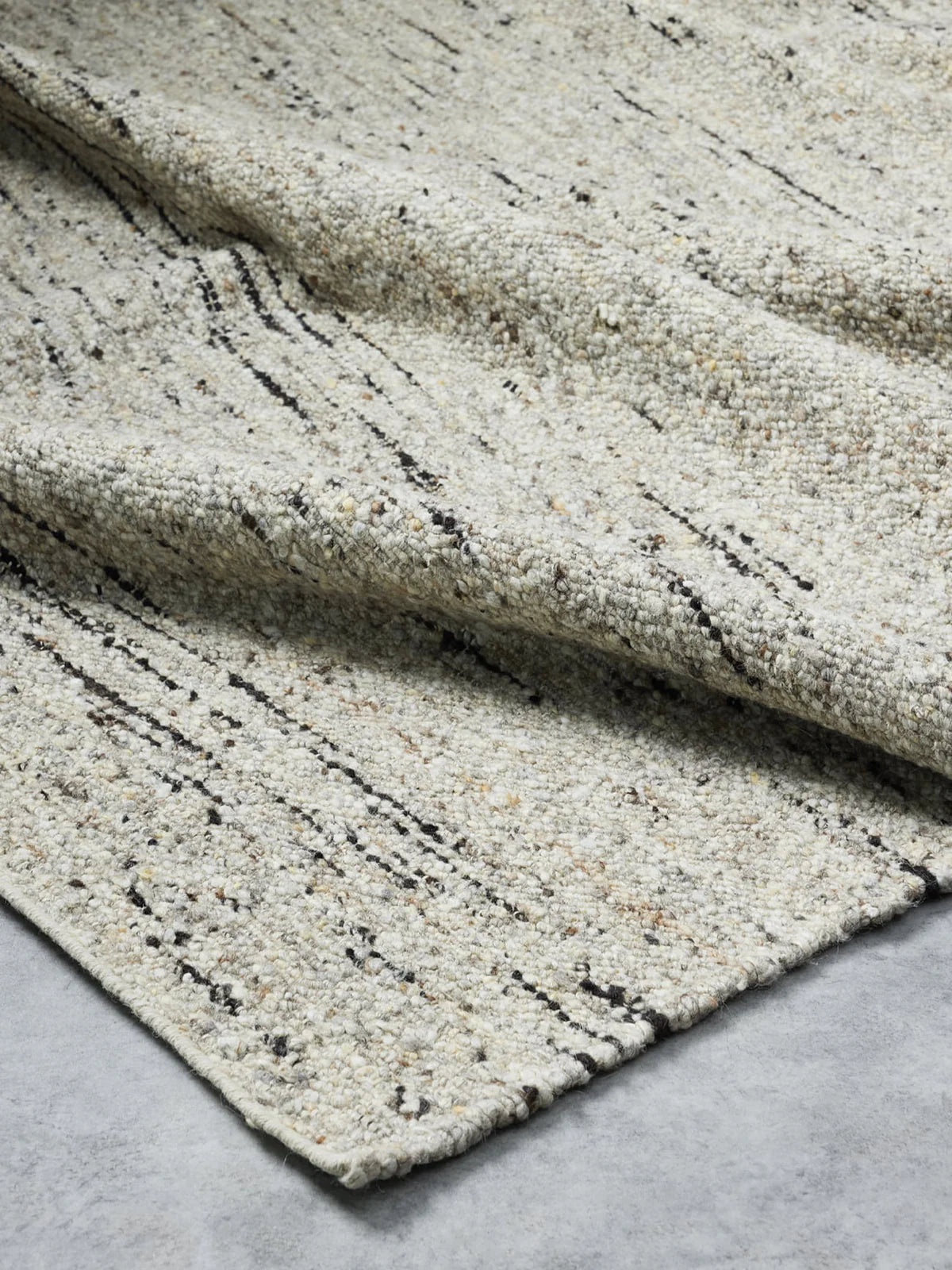Flint Rug by Tribe Home from Franka – durable, artisan-made floor rug in smoky greys, adding depth and warmth to any room