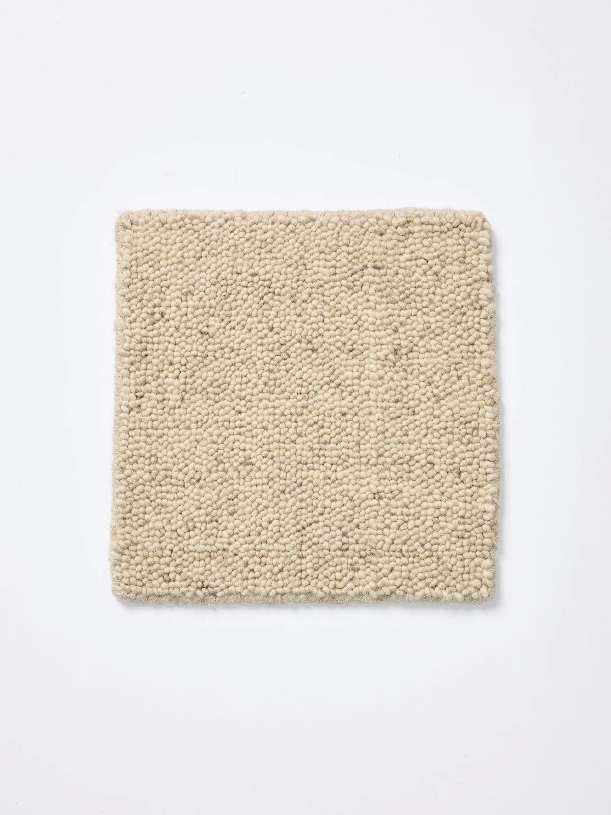 Nobel Rug by Tribe Home in Light Beige – textured wool rug with tonal variation in a soft, earthy shade for timeless appeal.