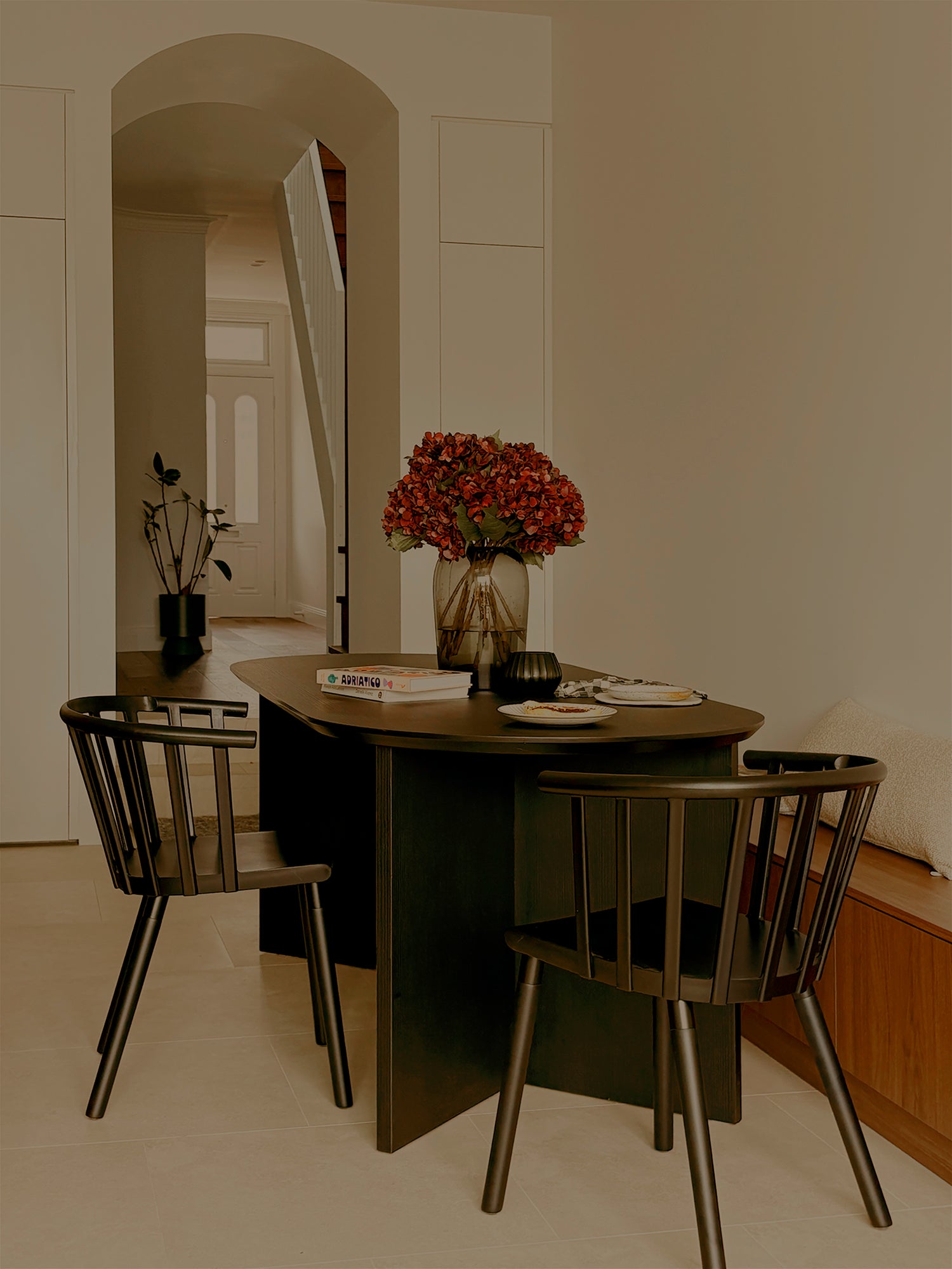 Black Vicky spindle chair styled around a timber dining table in a modern dining room