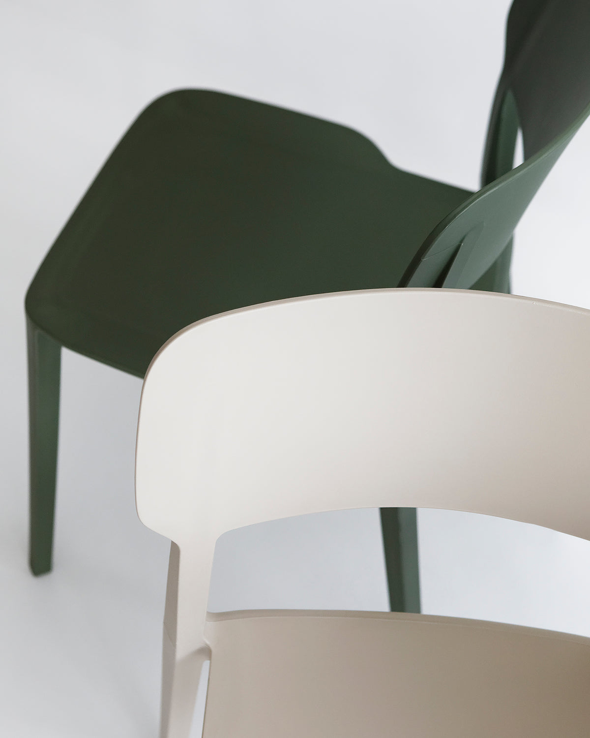 Side view of the Alex Chair in Olive – clean-lined silhouette with contoured backrest and durable plastic build