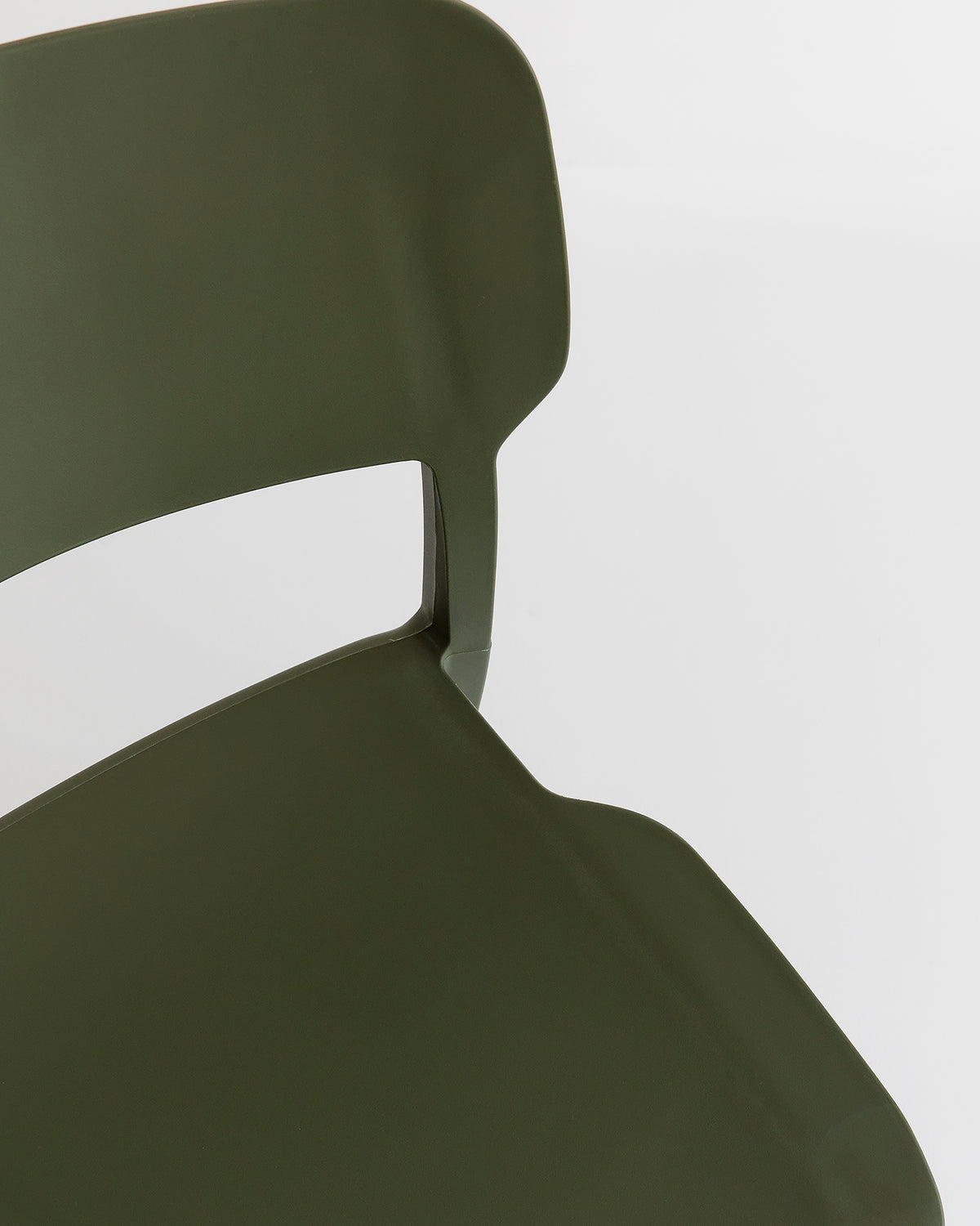 Close-up of Alex Chair in Olive – minimalist plastic chair designed for everyday comfort and longevity