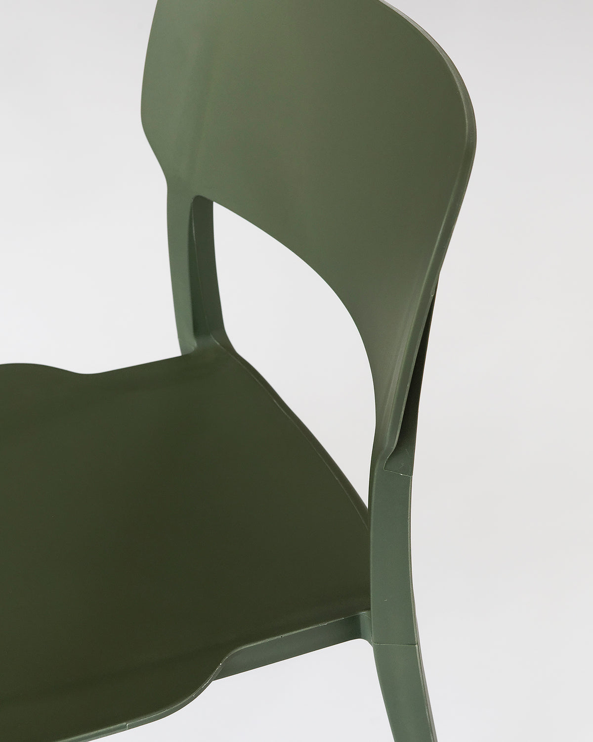 Side view of the Alex Chair in Olive – clean-lined silhouette with contoured backrest and durable plastic build