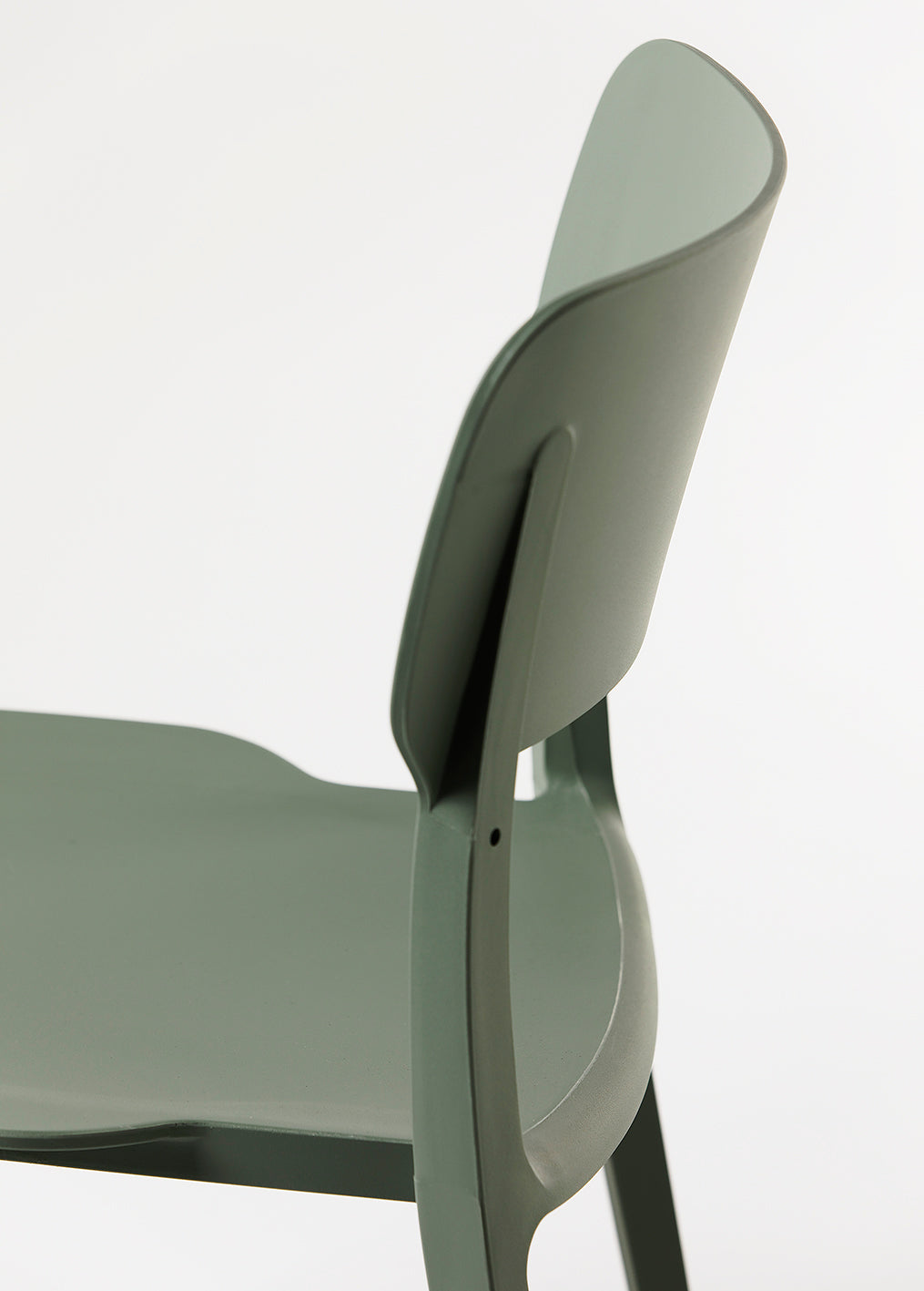 Side view of the Alex Chair in Olive – clean-lined silhouette with contoured backrest and durable plastic build.