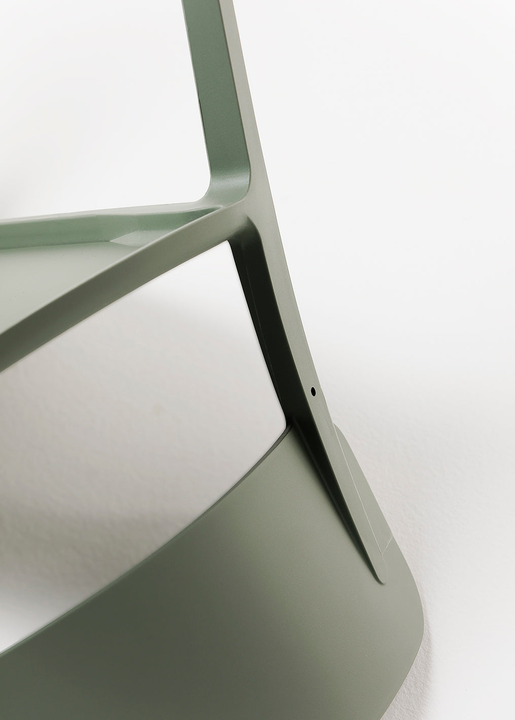 Close-up of Alex Chair in Olive – minimalist plastic chair designed for everyday comfort and longevity