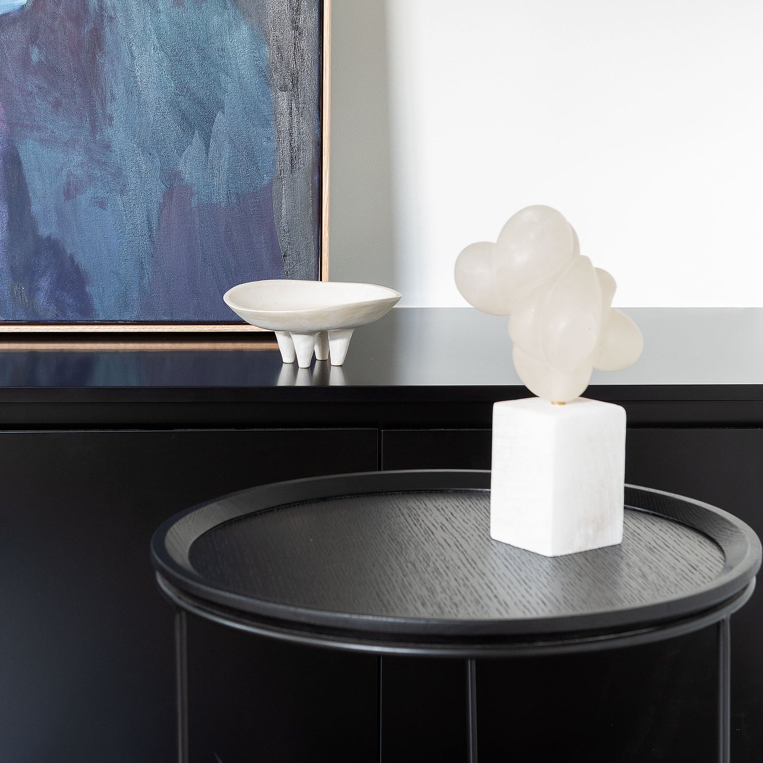 Freda Side Table in All Black styled in a minimal interior setting, highlighting its slim profile and sculptural form