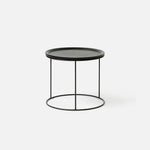 Close-up of the Freda Side Table in Black showing the deep-etched timber veneer top and smooth powder-coated edge