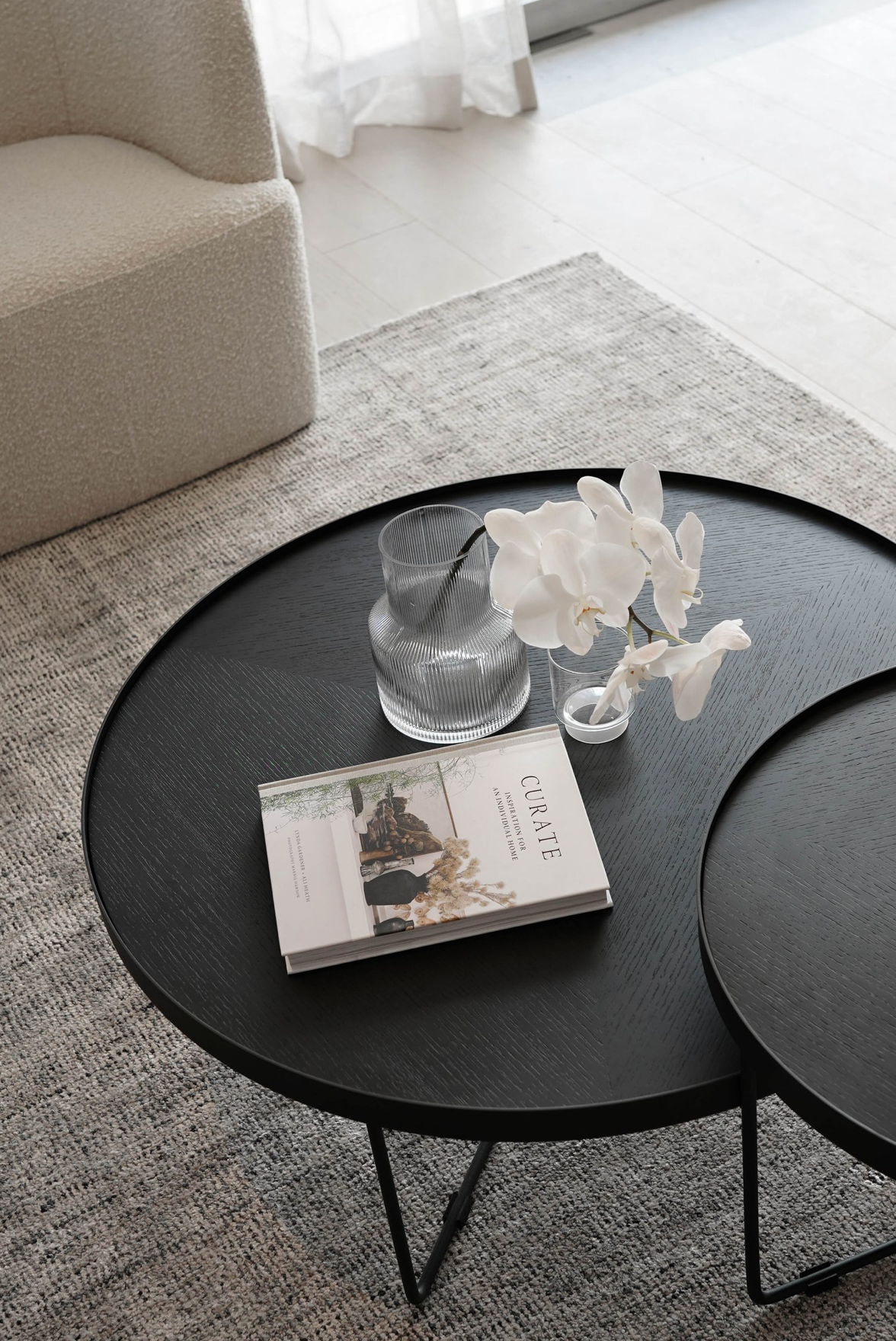 Sia Nesting Tables in black finish, stacked to save space – stylish and functional nesting coffee tables