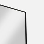 Close-up of black Luca Mirror showing deep etched metal frame texture