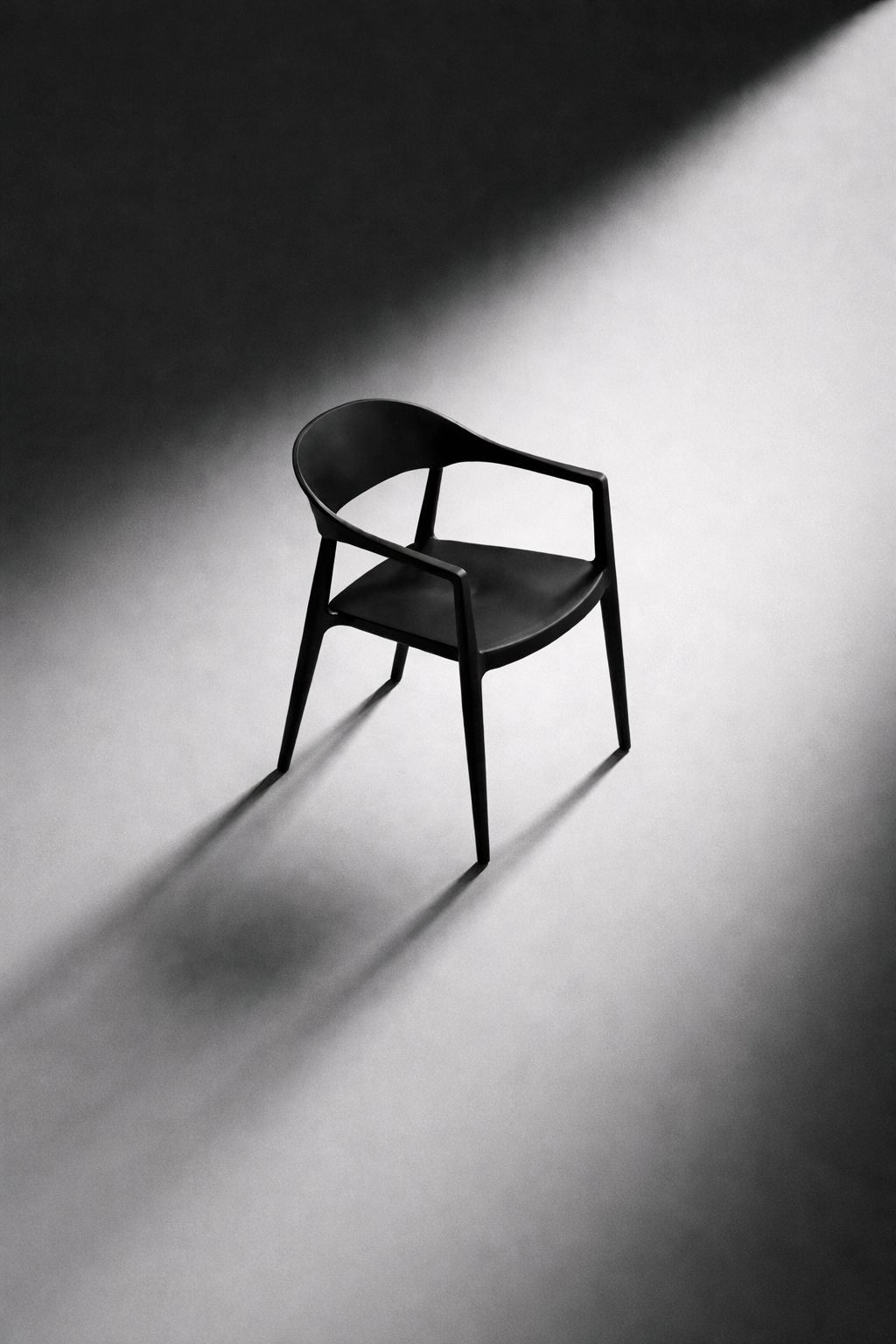 Arlo Chair in black, a studio shot of the stackable dining chair