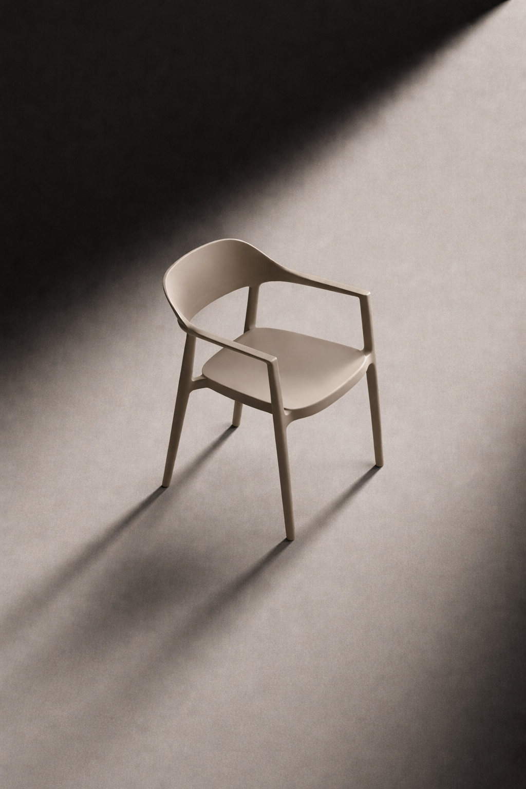 Arlo Chair in driftwood, a studio shot of the stackable dining chair