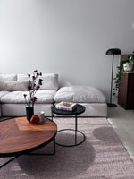 Billie modular couch in white fabric styled with a modern rug and coffee table for a contemporary living room