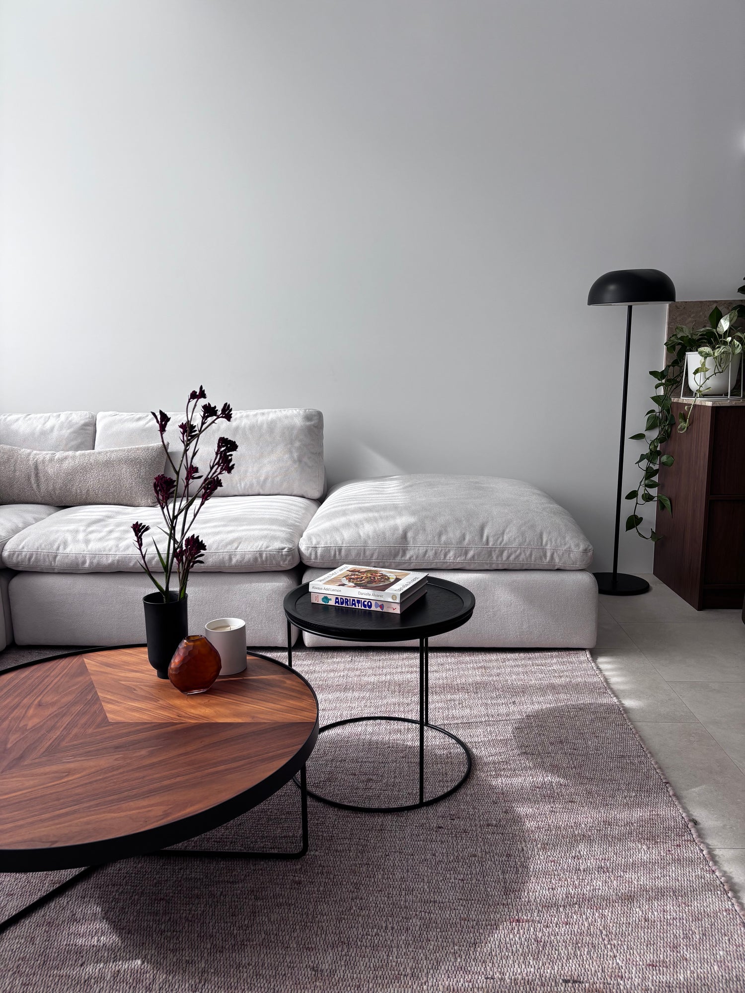 Billie modular couch in white fabric styled with a modern rug and coffee table for a contemporary living room