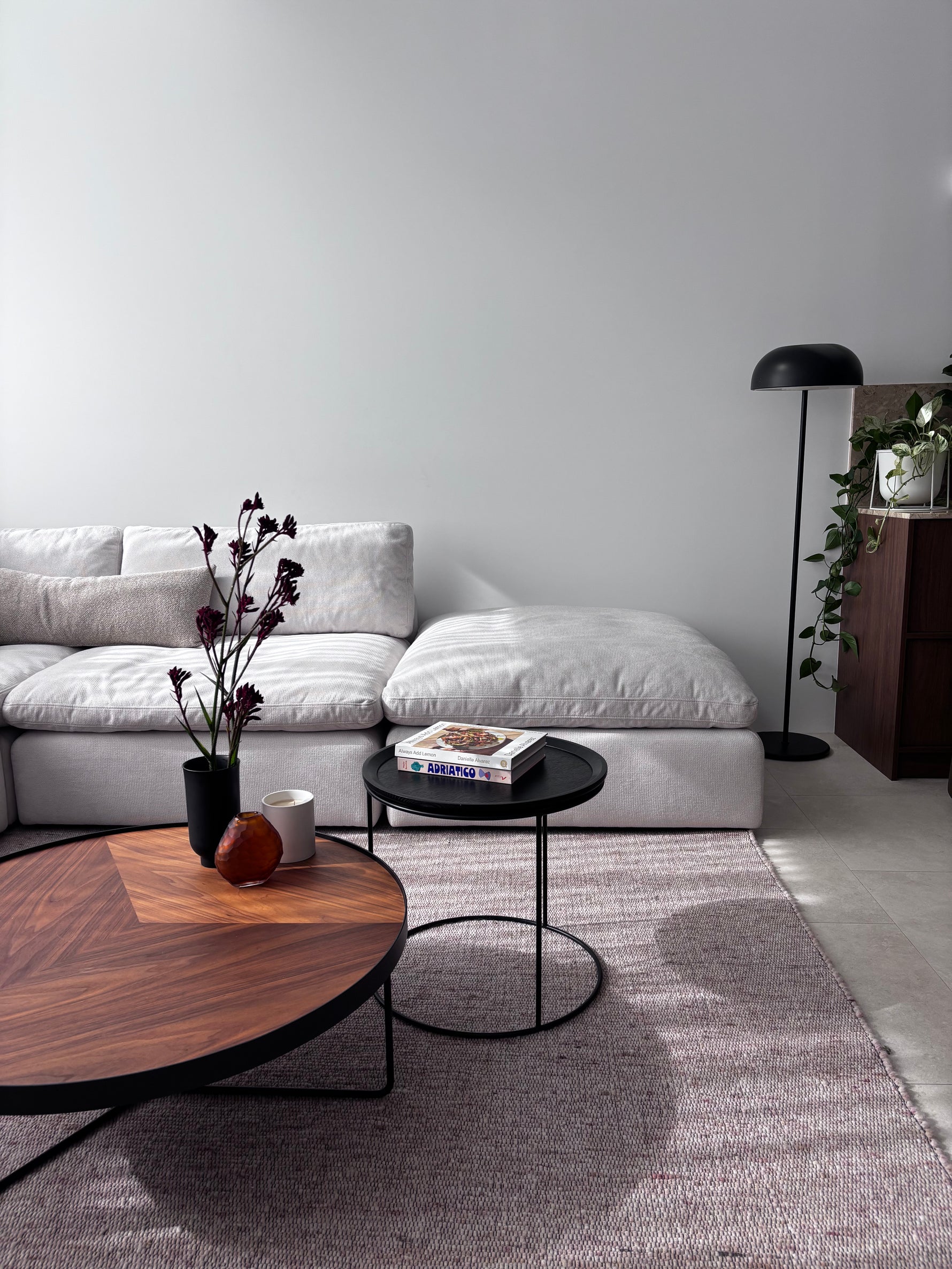 Billie modular couch in white fabric styled with a modern rug and coffee table for a contemporary living room