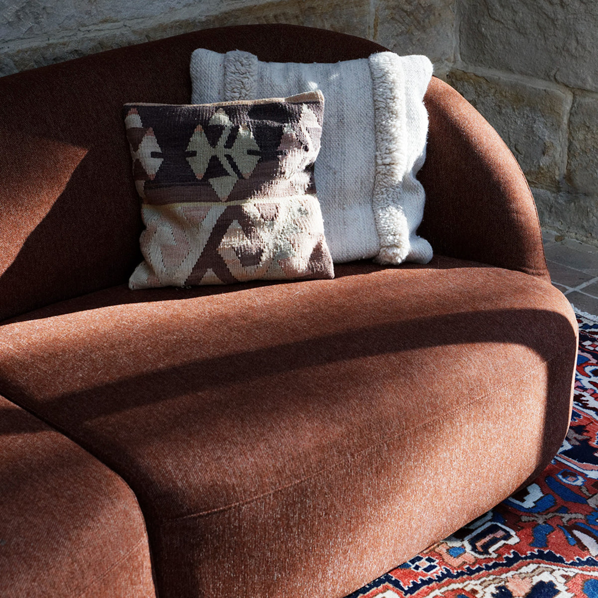 Close-up of the Calvin Sofa in Rove brick, showing the fabric texture