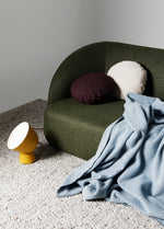 Calvin 2 seat comfortable sofa in olive green fabric styled in a light-filled modern living room
