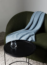 Calvin 3 seat modular lounge in olive fabric styled with coffee table and neutral rug in a modern living room