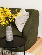 Calvin 2 seat comfortable sofa in olive green fabric styled in a light-filled modern living room