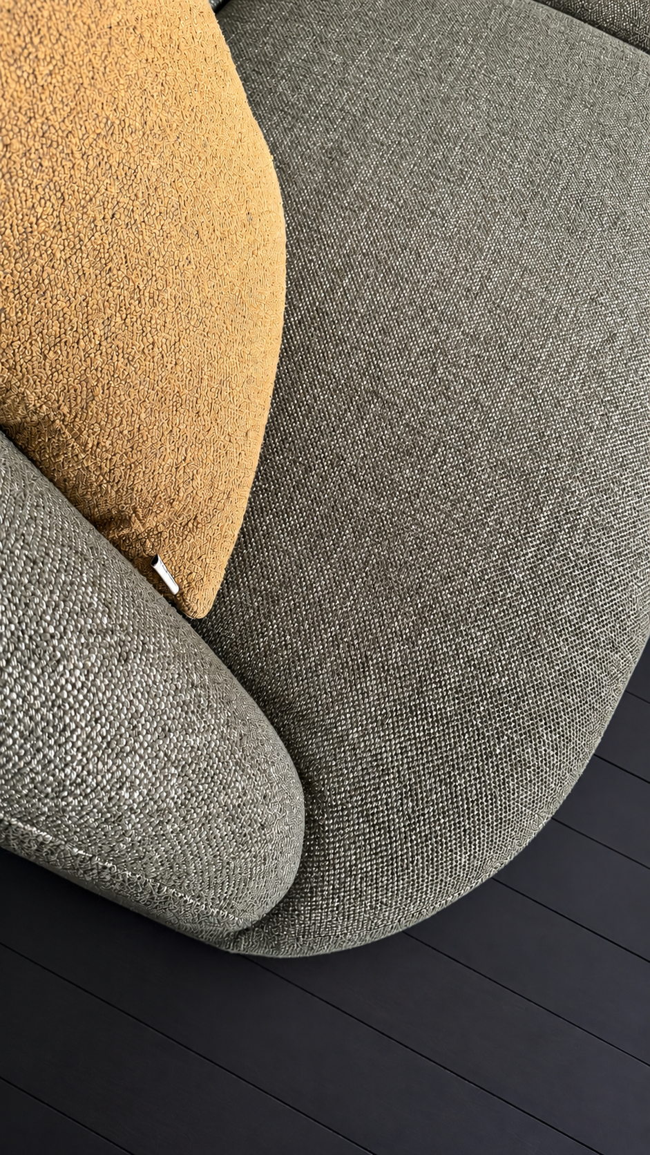 Corner detail of the Calvin Sofa in Rove olive, showing the modular join