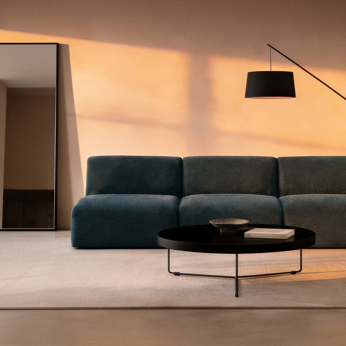 Calvin Sofa in Electra teal styled with a black coffee table and floor lamp