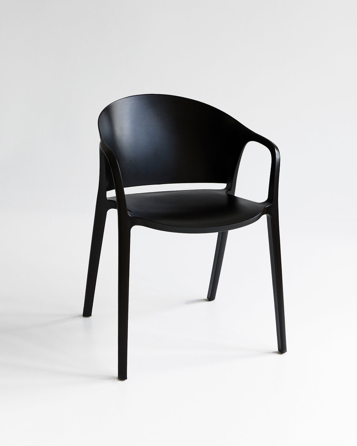 Front view of the Carla Chair in Black with clean silhouette and solid tone