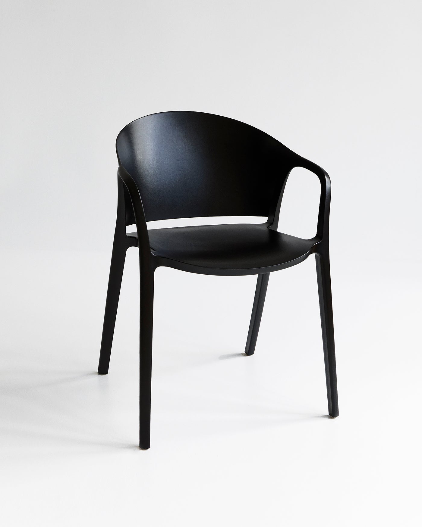 Front view of the Carla Chair in Black with clean silhouette and solid tone