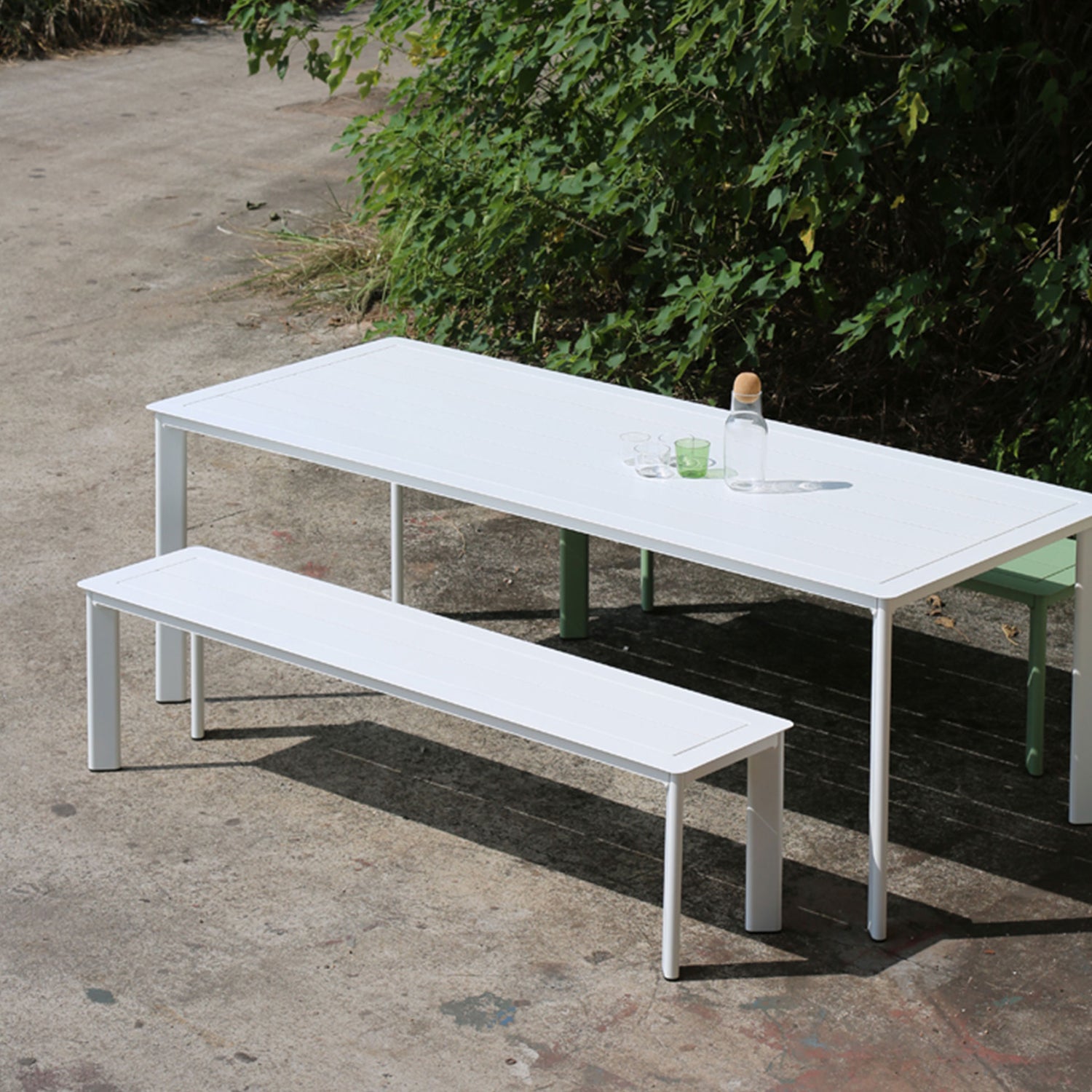 White outdoor bench seat in a modern alfresco dining area
