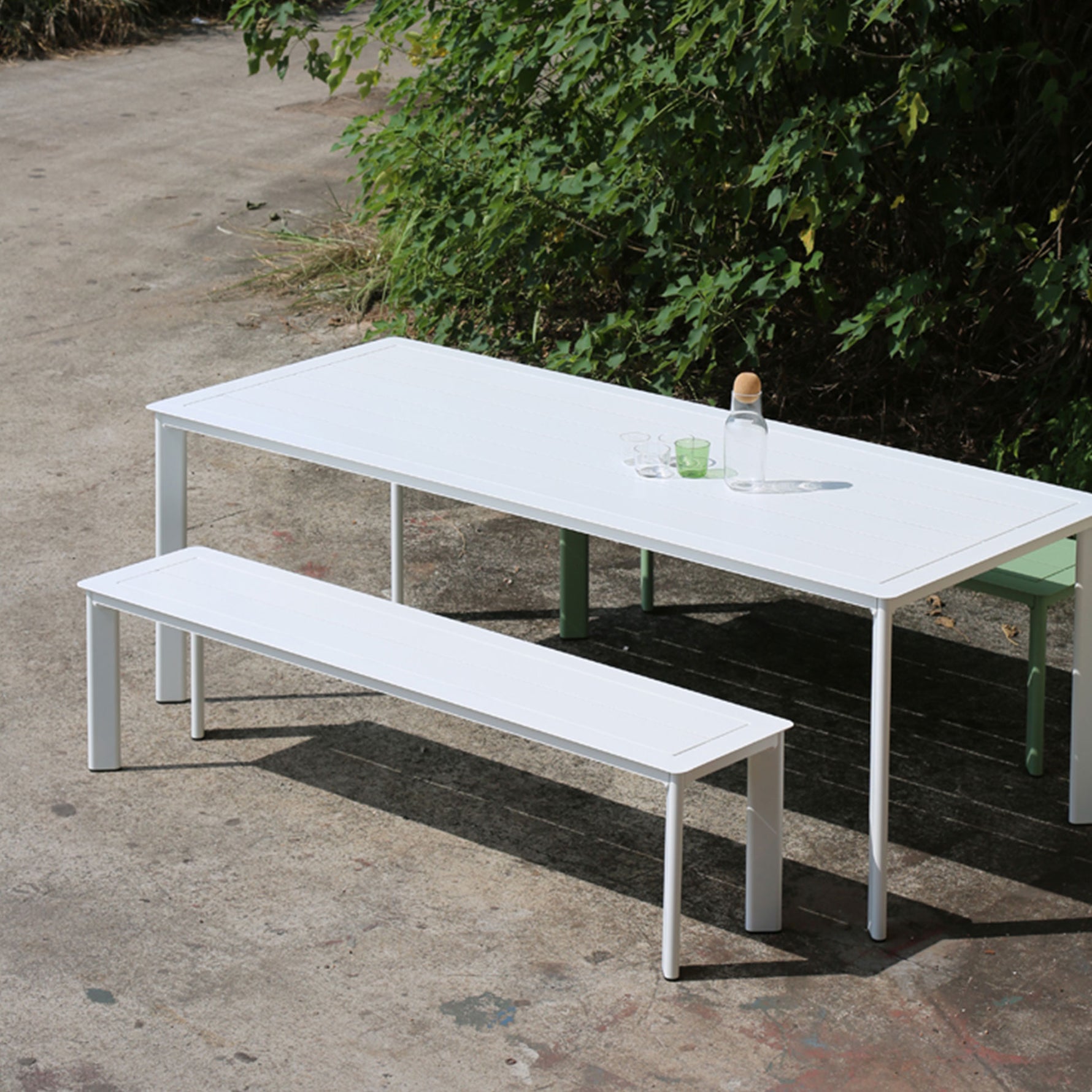 White outdoor bench seat in a modern alfresco dining area