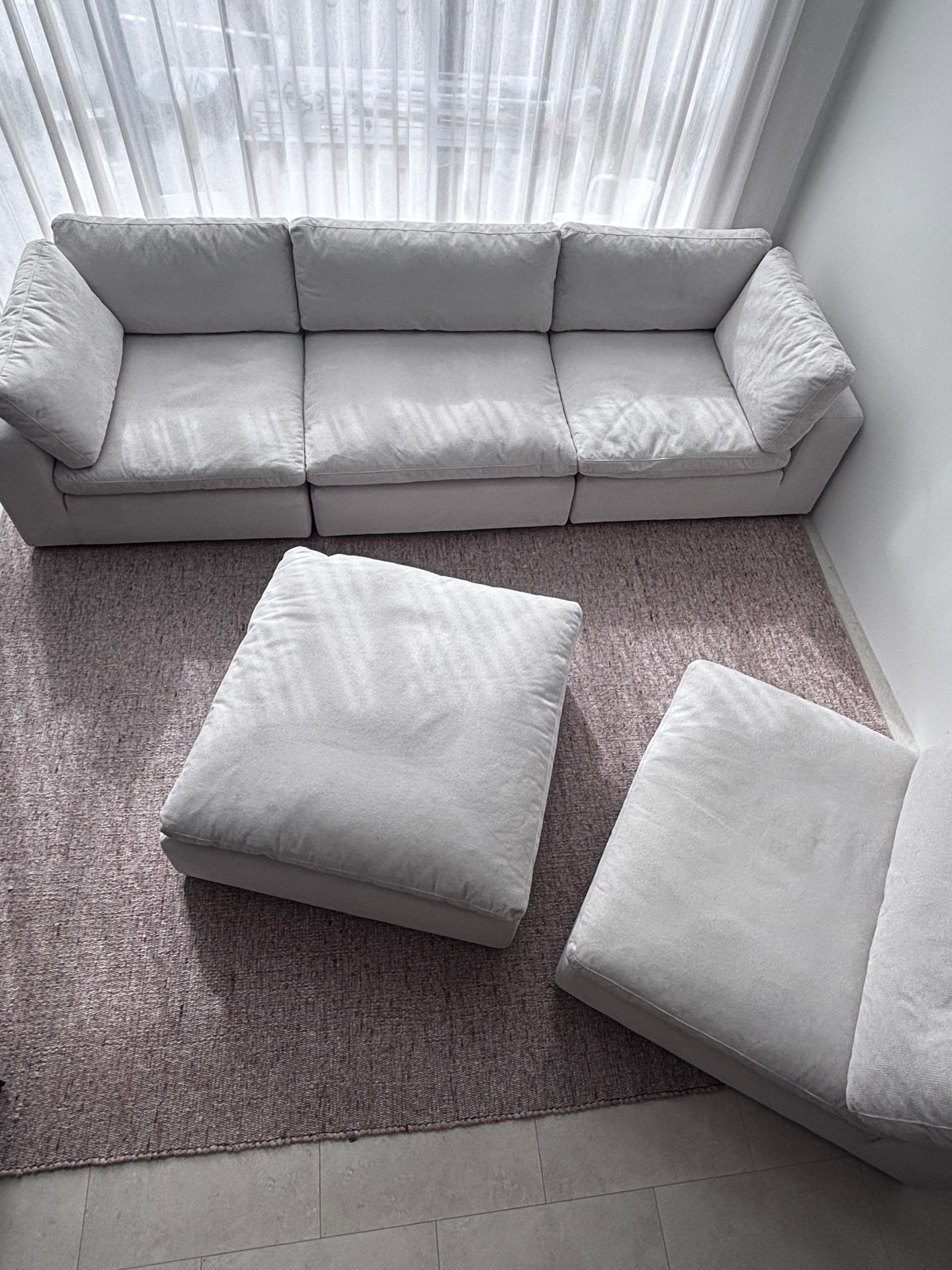 Comfortable couch paired with a coffee table and rug, designed for modern family living