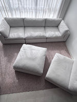 Comfortable couch paired with a coffee table and rug, designed for modern family living