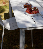 White Estelle outdoor dining table with modern, minimalist design
