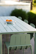 Comfortable outdoor dining setting with Estelle table and Remy chairs in eucalypt finish