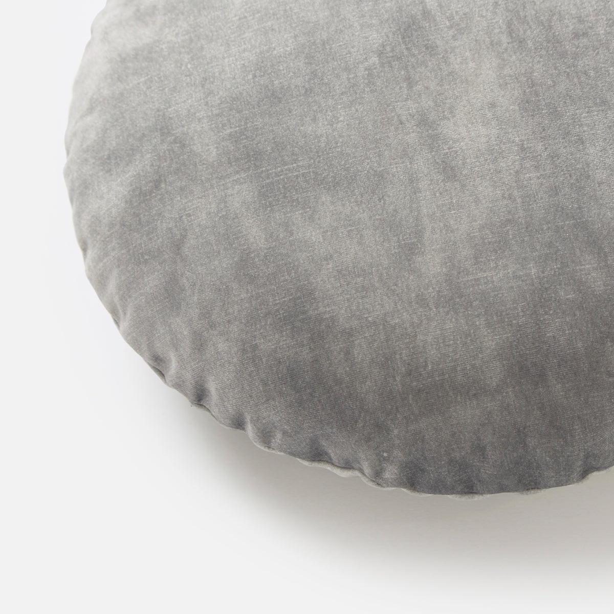 Close-up of the Electra Round Cushion in blue velvet, showing the pile