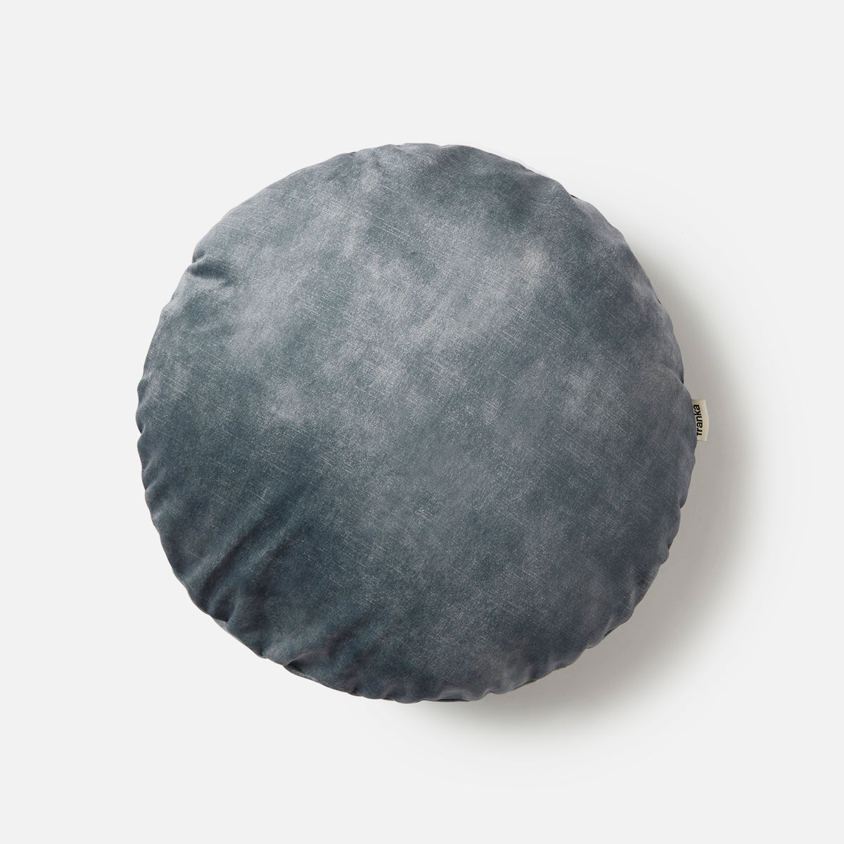 Electra Round Cushion in petrol velvet shown front-on