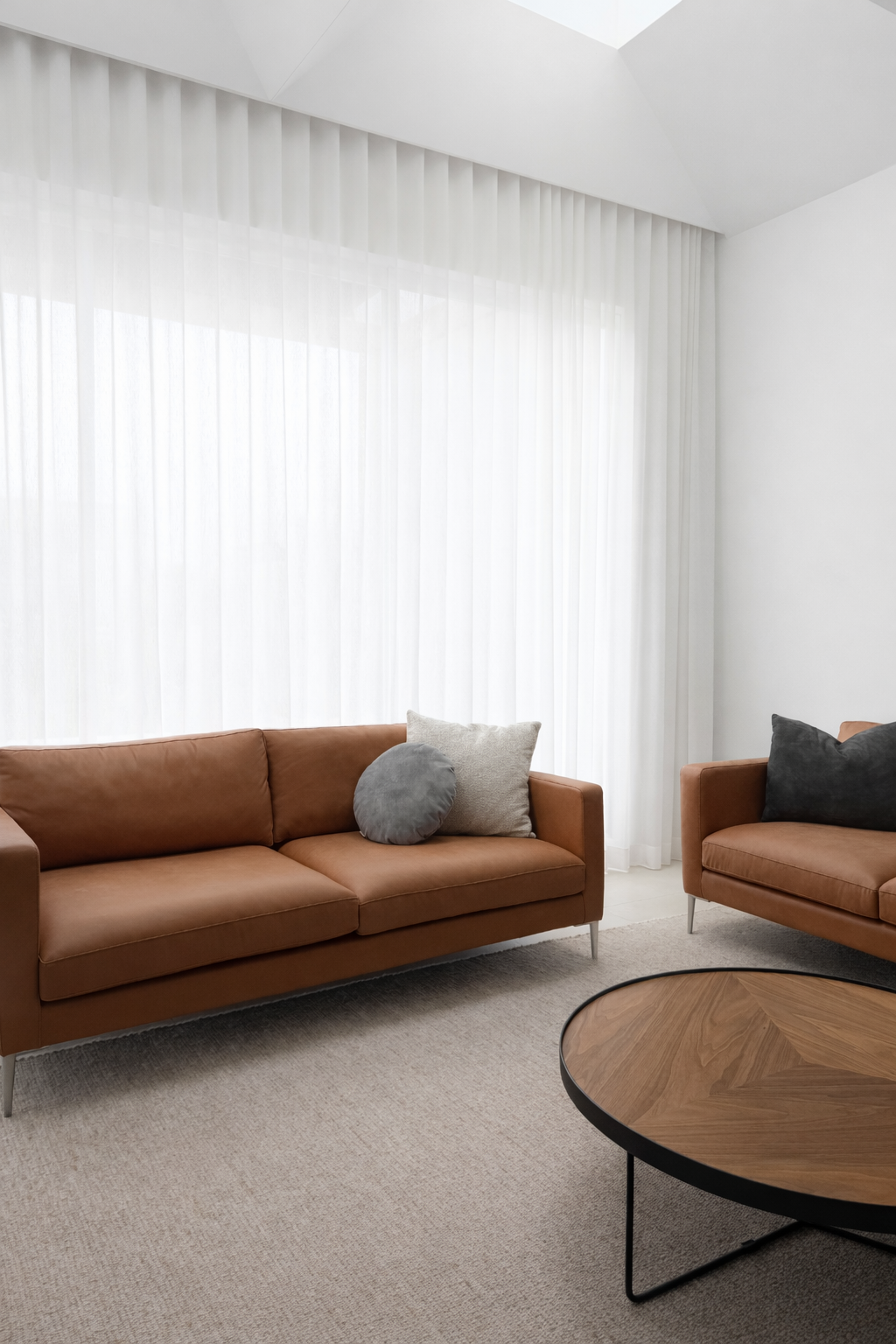 2 Seat leather sofa against white curatin