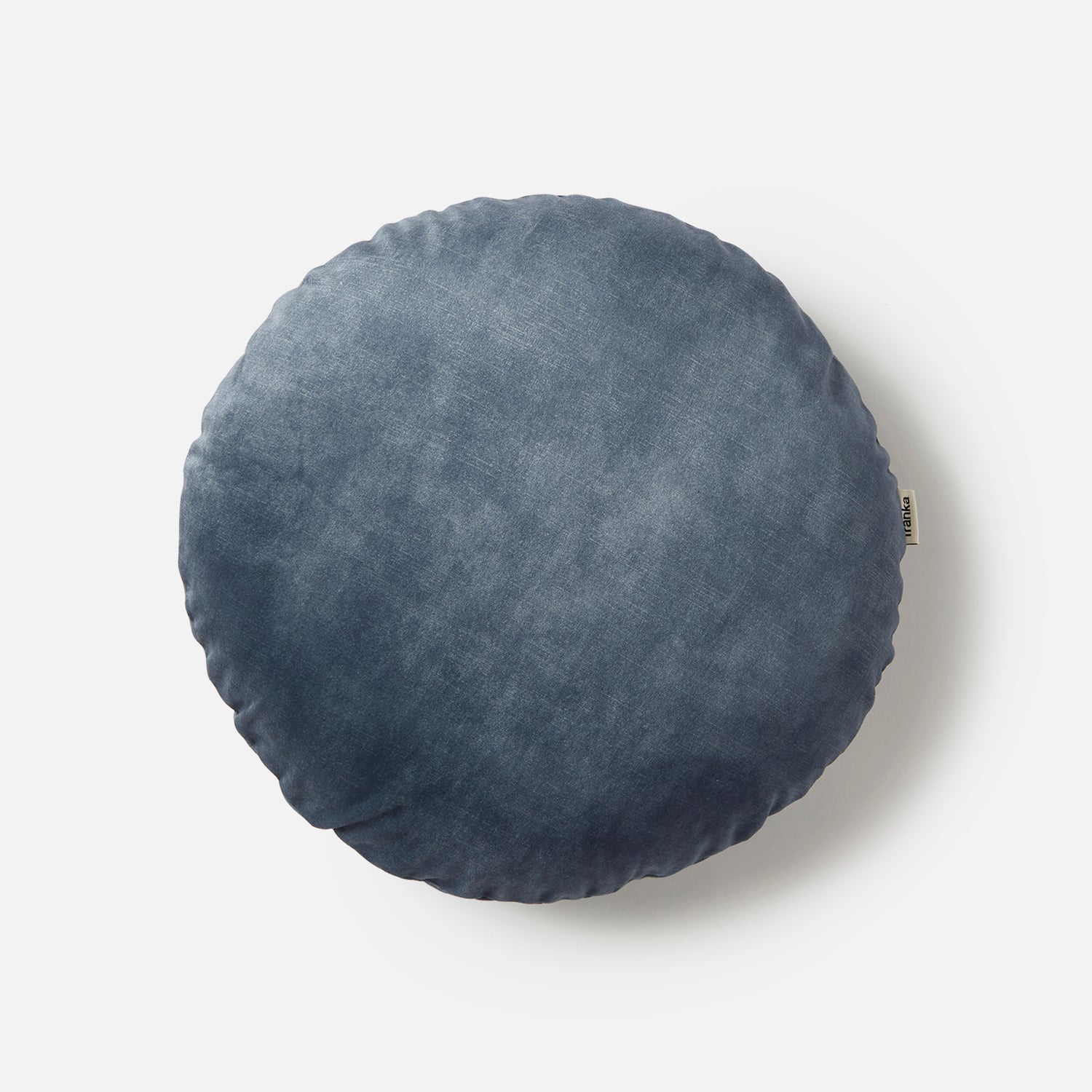 Soft and luxurious petrol velvet cushion in a round design