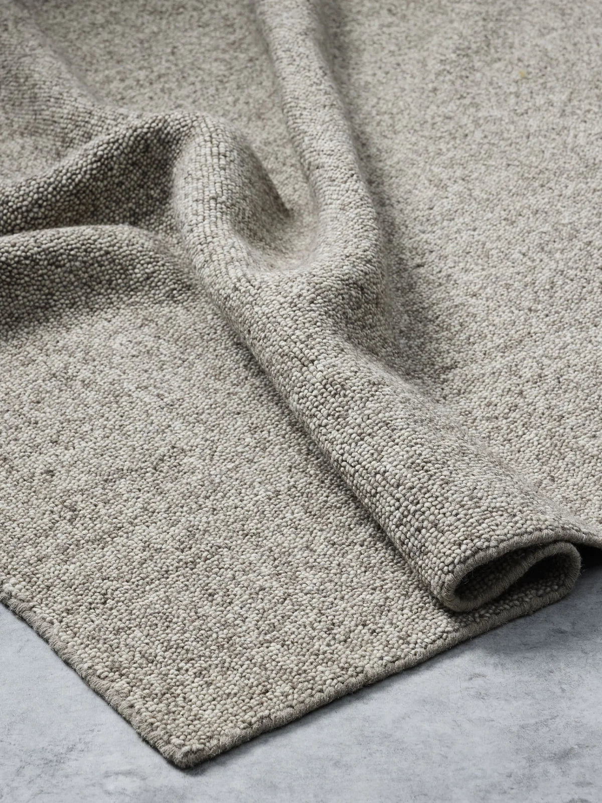 Franka’s Nobel Wool Rug in Dark Beige by Tribe Home – textured neutral rug with tonal variation, crafted in 100% wool