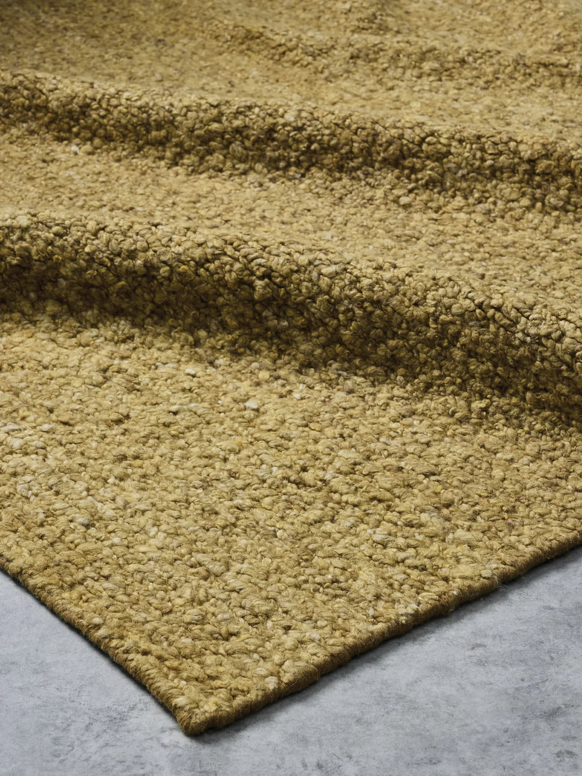 Roam Rug by Tribe Home in Crocodile – rich olive-toned wool blend rug with textured weave, perfect for earthy, grounded interiors.