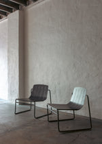 Two Frankie outdoor lounge chairs in charcoal styled in a cosy, sheltered alfresco nook