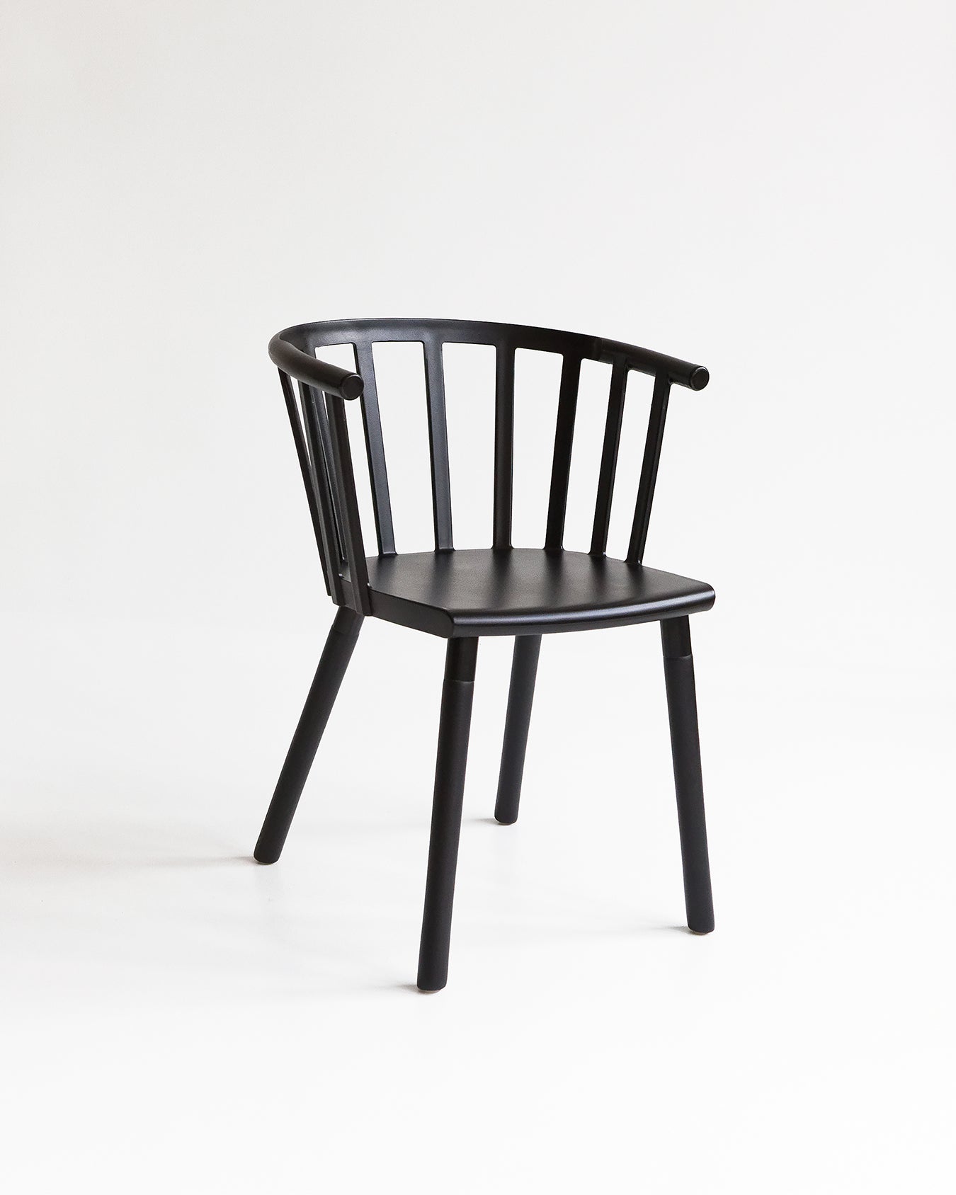 Black Vicky dining chair with spindle back design shown front-on against a plain background