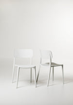 Angled shot of the White Alex Chair showing its lightweight frame and soft matte finish.