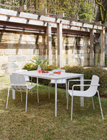 Stylish white outdoor dining chair with arms for added comfort