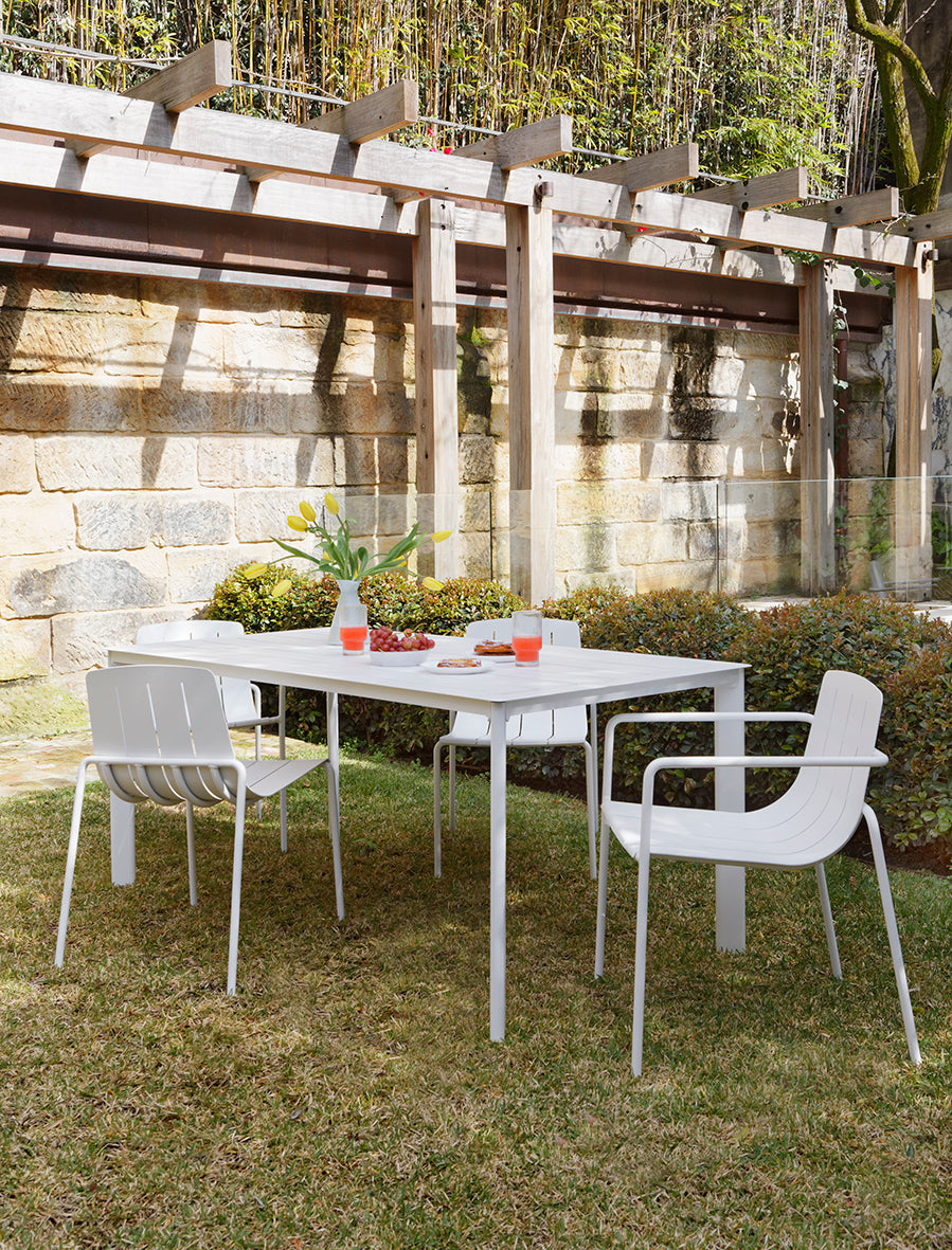 Stylish white outdoor dining chair with arms for added comfort