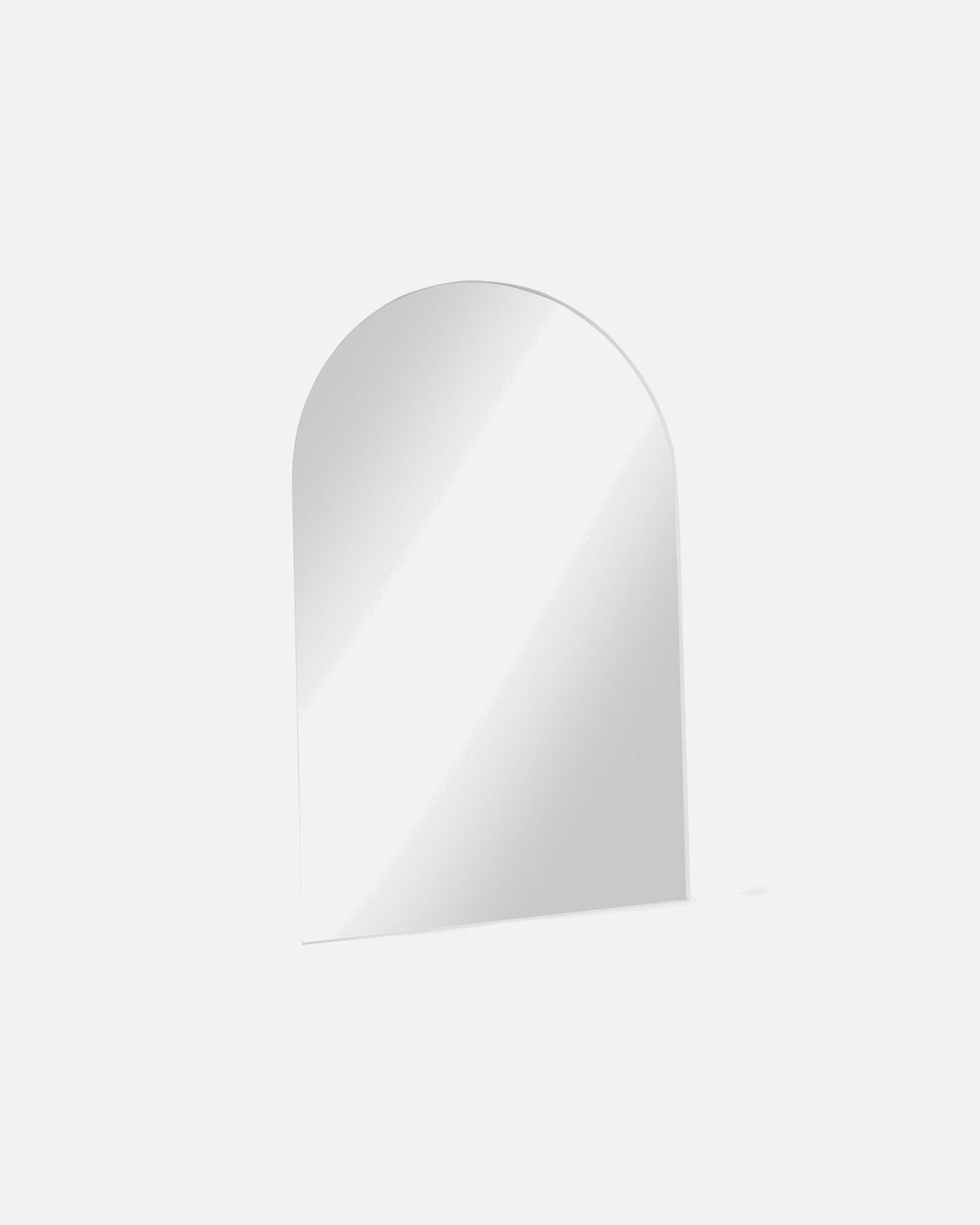 Archie Oversized Mirror in white shown at an angle, showing the depth of its metal frame