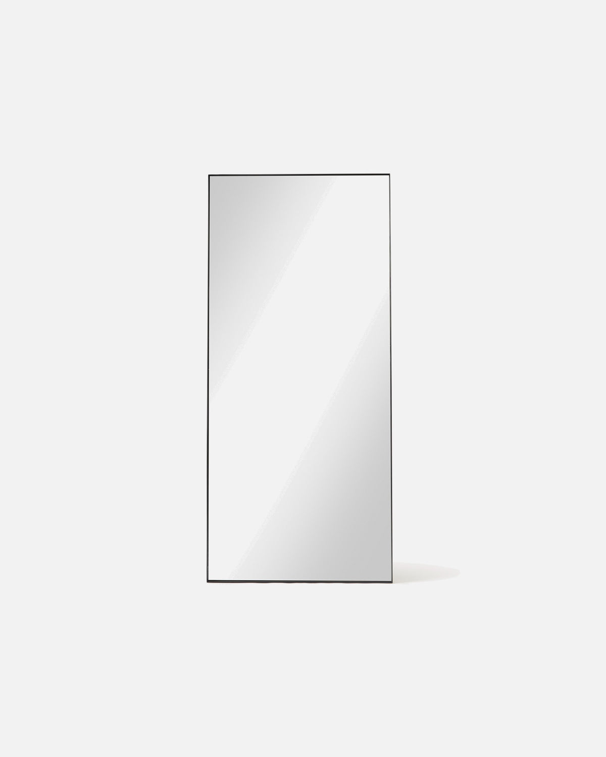 Luca Oversized Mirror in black shown front-on, a tall rectangular full-length mirror