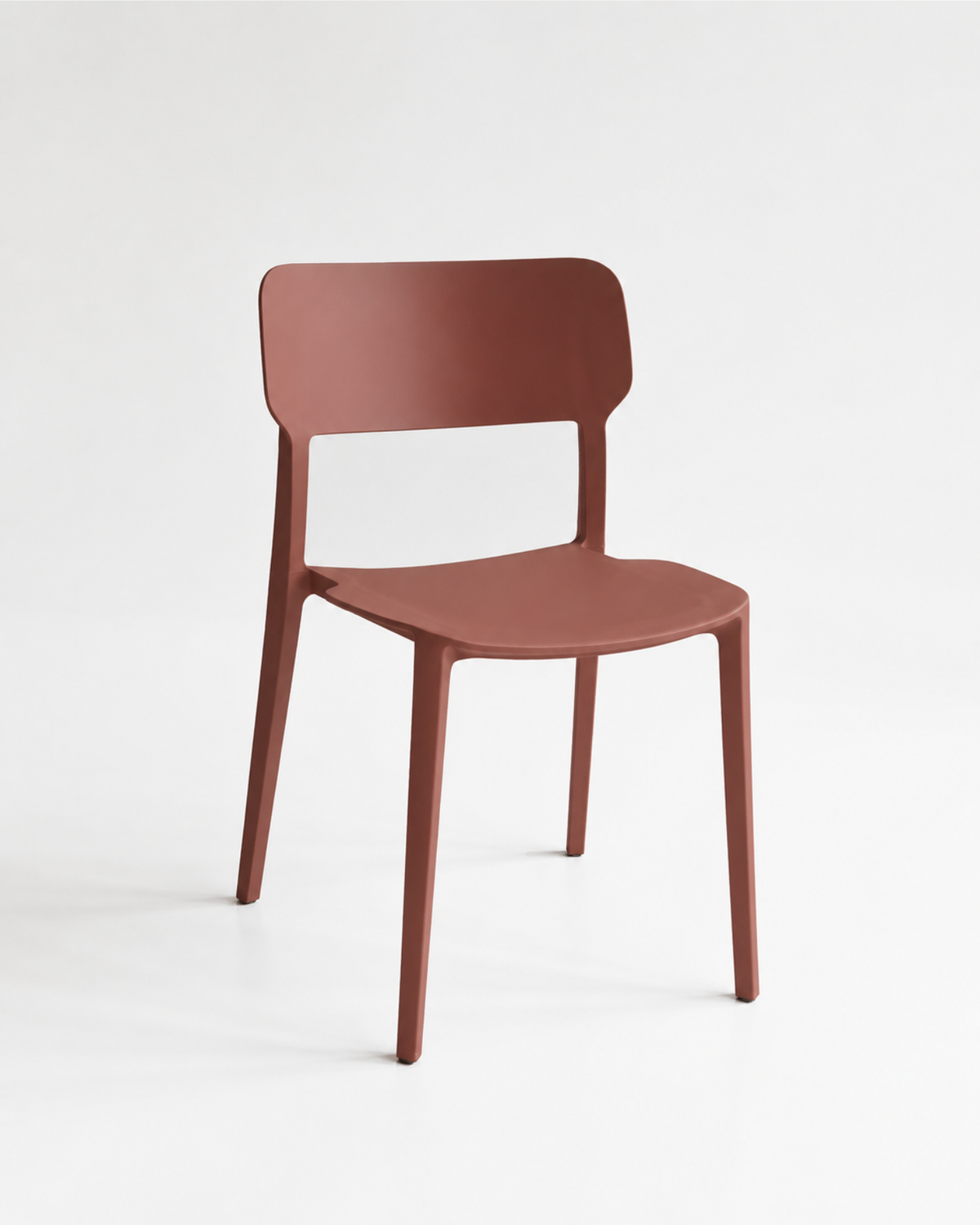 Alex Chair in russet, a stackable polypropylene dining chair shown at an angle