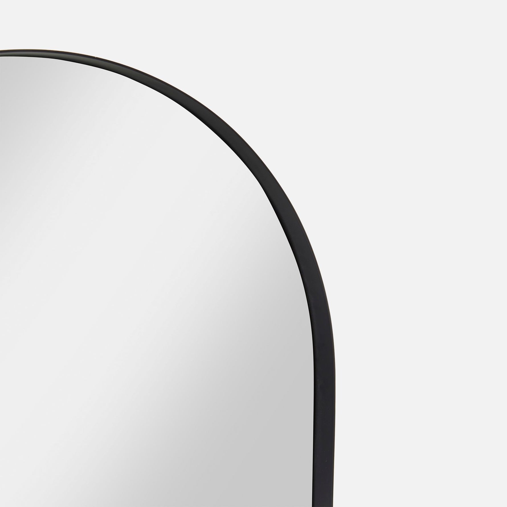 Material detail of the black Archie Arch Mirror with etched metal surface

